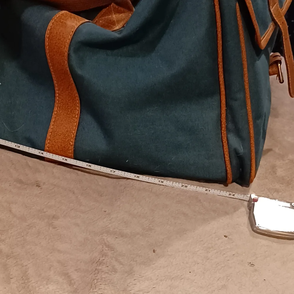 Duffle bag fancy straps are nice accents to this bag